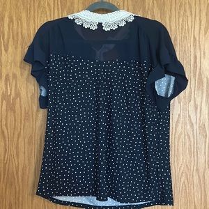 Navy blue polka dot blouse with lace collar